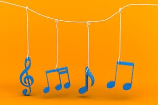 Musical notes dangling by strings